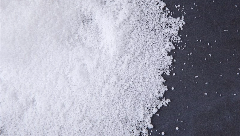 High-purity white Caustic Soda Pearls (NaOH) in a pile, used for industrial application